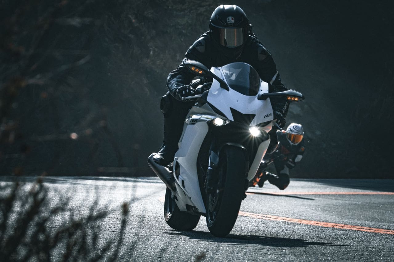 Motorcycle rider with insurance coverage for safer riding experiences.